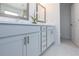 Bright bathroom featuring a double sink vanity with modern fixtures, and stylish cabinets at 107 Iveybrooke Ln # 58, Alpharetta, GA 30009