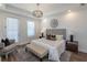 Primary bedroom showcasing a cozy bench, natural light, and elegant decor at 107 Iveybrooke Ln # 58, Alpharetta, GA 30009