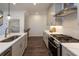 Modern kitchen featuring stainless steel appliances, quartz countertops and dark wood flooring at 107 Iveybrooke Ln # 58, Alpharetta, GA 30009