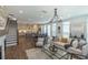 Open concept living room and dining area with hardwood floors and staircase to the second floor at 107 Iveybrooke Ln # 58, Alpharetta, GA 30009