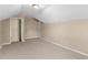 Finished attic features neutral walls and carpeting at 124 Williams Blf, Mcdonough, GA 30252