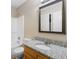 Bathroom featuring granite countertops, a sink, and tiled walls at 124 Williams Blf, Mcdonough, GA 30252