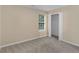 Bedroom featuring neutral walls and carpet, and closet at 124 Williams Blf, Mcdonough, GA 30252
