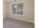 Neutral bedroom with a large window and plush carpeting at 124 Williams Blf, Mcdonough, GA 30252