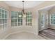 Bright breakfast nook with lots of windows and new vinyl flooring at 124 Williams Blf, Mcdonough, GA 30252