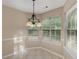 Breakfast nook with a hanging light fixture and plenty of natural light from the large windows at 124 Williams Blf, Mcdonough, GA 30252