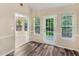 Bright dining space featuring stylish flooring, trim, and plenty of sunlight at 124 Williams Blf, Mcdonough, GA 30252