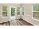 Charming dining room featuring new flooring, trim, and natural light at 124 Williams Blf, Mcdonough, GA 30252