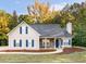 Charming home featuring stone accents, a chimney, and a well-maintained lawn at 124 Williams Blf, Mcdonough, GA 30252