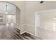 Open-concept home with modern flooring, neutral walls, and an arched doorway at 124 Williams Blf, Mcdonough, GA 30252