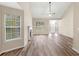 Spacious living room with a fireplace, ample natural light, and stylish floors at 124 Williams Blf, Mcdonough, GA 30252