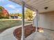 Covered porch showing a view of the large landscaped front yard of the property at 124 Williams Blf, Mcdonough, GA 30252