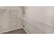 Walk-in closet with wire shelving and carpet flooring offers ample storage space at 124 Williams Blf, Mcdonough, GA 30252