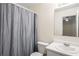 Functional bathroom with a shower-tub combination, a clean white vanity, and a well-lit mirror for everyday convenience at 2419 Ivey Crest Cir, Tucker, GA 30084