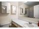 Bathroom with white sink, mirror, and vanity with a view into the shower and toilet at 2419 Ivey Crest Cir, Tucker, GA 30084
