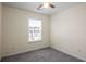 Bright bedroom featuring neutral walls, plush carpeting, and a window with neighborhood views at 2419 Ivey Crest Cir, Tucker, GA 30084
