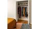 Bedroom closet with bi-fold doors and shelving for clothes and shoes in an organized space at 4228 Durham Cir, Stone Mountain, GA 30083