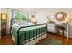 Well-lit bedroom featuring hardwood floors, natural light, and neutral wall colors at 4228 Durham Cir, Stone Mountain, GA 30083