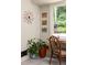 Quaint dining area featuring a unique clock and views of the lush green yard at 4228 Durham Cir, Stone Mountain, GA 30083