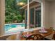 Bright dining area with an oversized window view of the swimming pool at 4228 Durham Cir, Stone Mountain, GA 30083