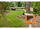 Charming home with a landscaped yard, convenient carport, and a unique community book exchange box for added charm at 4228 Durham Cir, Stone Mountain, GA 30083