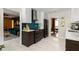 Stylish kitchen featuring sleek cabinetry, modern appliances, and a view to living and dining areas at 4228 Durham Cir, Stone Mountain, GA 30083