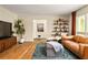 Inviting living room featuring hardwood floors, comfortable leather seating, and stylish decor accents at 4228 Durham Cir, Stone Mountain, GA 30083