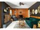 Inviting living room with a brick fireplace, wood paneling, and comfortable seating at 4228 Durham Cir, Stone Mountain, GA 30083