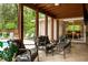 Stylish patio with cushioned seating, a ceiling fan, views of the pool, and access to the home's interior at 4228 Durham Cir, Stone Mountain, GA 30083