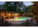 Backyard oasis with a sparkling swimming pool, ample lounge seating, and stone patio at 4228 Durham Cir, Stone Mountain, GA 30083