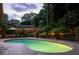 Beautifully landscaped backyard featuring a private swimming pool and patio area with outdoor seating at 4228 Durham Cir, Stone Mountain, GA 30083