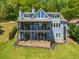 This home features a multi-level deck overlooking a lush backyard, perfect for entertaining at 5635 Cherokee Trce, Cumming, GA 30041