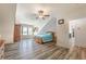 Bright bedroom features hardwood floors, neutral paint, and a view of the outdoors at 5635 Cherokee Trce, Cumming, GA 30041