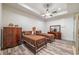 Cozy bedroom featuring two beds, classic dressers, and modern ceiling fan at 5635 Cherokee Trce, Cumming, GA 30041