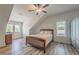 Bright bedroom offers hardwood floors, neutral paint, and natural light at 5635 Cherokee Trce, Cumming, GA 30041