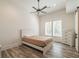 Bright bedroom with natural light, hardwood floors, and a large window at 5635 Cherokee Trce, Cumming, GA 30041
