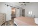 Cozy bedroom with ensuite bathroom access, hardwood floors, and a barn door at 5635 Cherokee Trce, Cumming, GA 30041