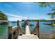 Private boat dock with wooden walkway leading to the lift, surrounded by tranquil lake waters at 5635 Cherokee Trce, Cumming, GA 30041