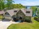 Charming home features a craftsman-style exterior, a spacious garage and a beautifully landscaped lawn at 5635 Cherokee Trce, Cumming, GA 30041