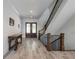 Elegant foyer features hardwood floors, staircase with wrought iron railings, and a decorative table at 5635 Cherokee Trce, Cumming, GA 30041