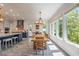 This spacious kitchen with lots of natural light offers a view of the yard with mature trees at 5635 Cherokee Trce, Cumming, GA 30041