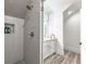 Luxurious bathroom features a modern shower with glass door and ceramic tile at 5635 Cherokee Trce, Cumming, GA 30041