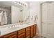 Bright bathroom with double sinks and wood cabinetry at 1016 Lenox Ne Crst, Atlanta, GA 30324