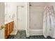 Bathroom featuring a tiled floor, oak cabinets, and tub with shower at 1016 Lenox Ne Crst, Atlanta, GA 30324