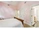 Pink bedroom with vaulted ceilings and ensuite bathroom at 1016 Lenox Ne Crst, Atlanta, GA 30324