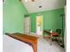 Green bedroom featuring a desk, and view to the ensuite bathroom at 1016 Lenox Ne Crst, Atlanta, GA 30324