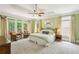 Spacious bedroom featuring a king bed, sitting area and doors leading to outdoor deck at 1016 Lenox Ne Crst, Atlanta, GA 30324