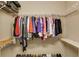 Walk in closet features a variety of shelving and hanging space for optimal storage at 1016 Lenox Ne Crst, Atlanta, GA 30324