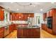 Modern kitchen equipped with stainless steel appliances, a center island, and ample cabinet space at 1016 Lenox Ne Crst, Atlanta, GA 30324