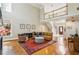 Spacious living room featuring hardwood floors, fireplace, and a view of the foyer at 1016 Lenox Ne Crst, Atlanta, GA 30324